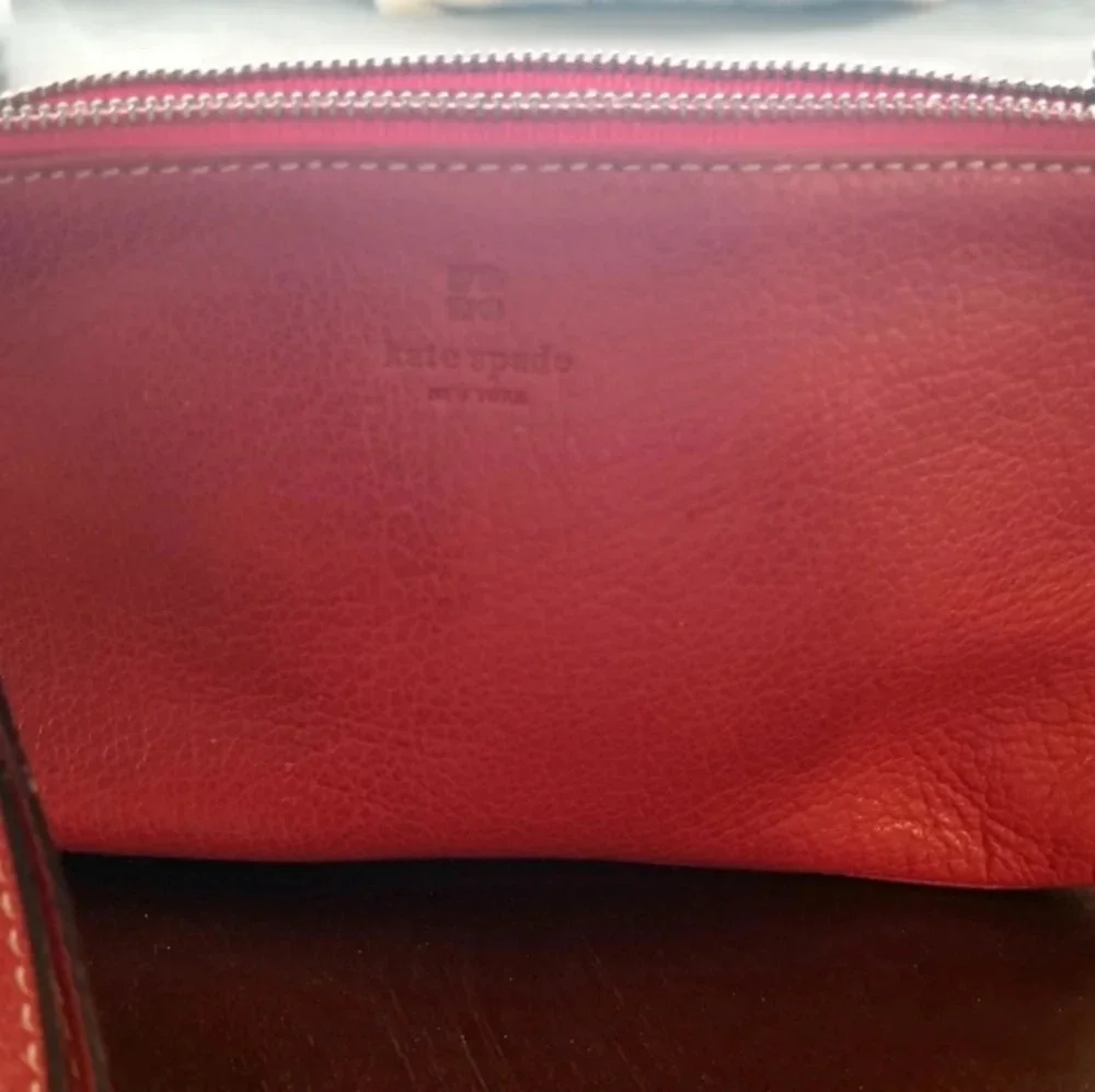 Kate Spade red pebbled leather wristlet bag